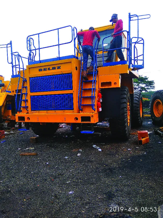 Workers on haul truck